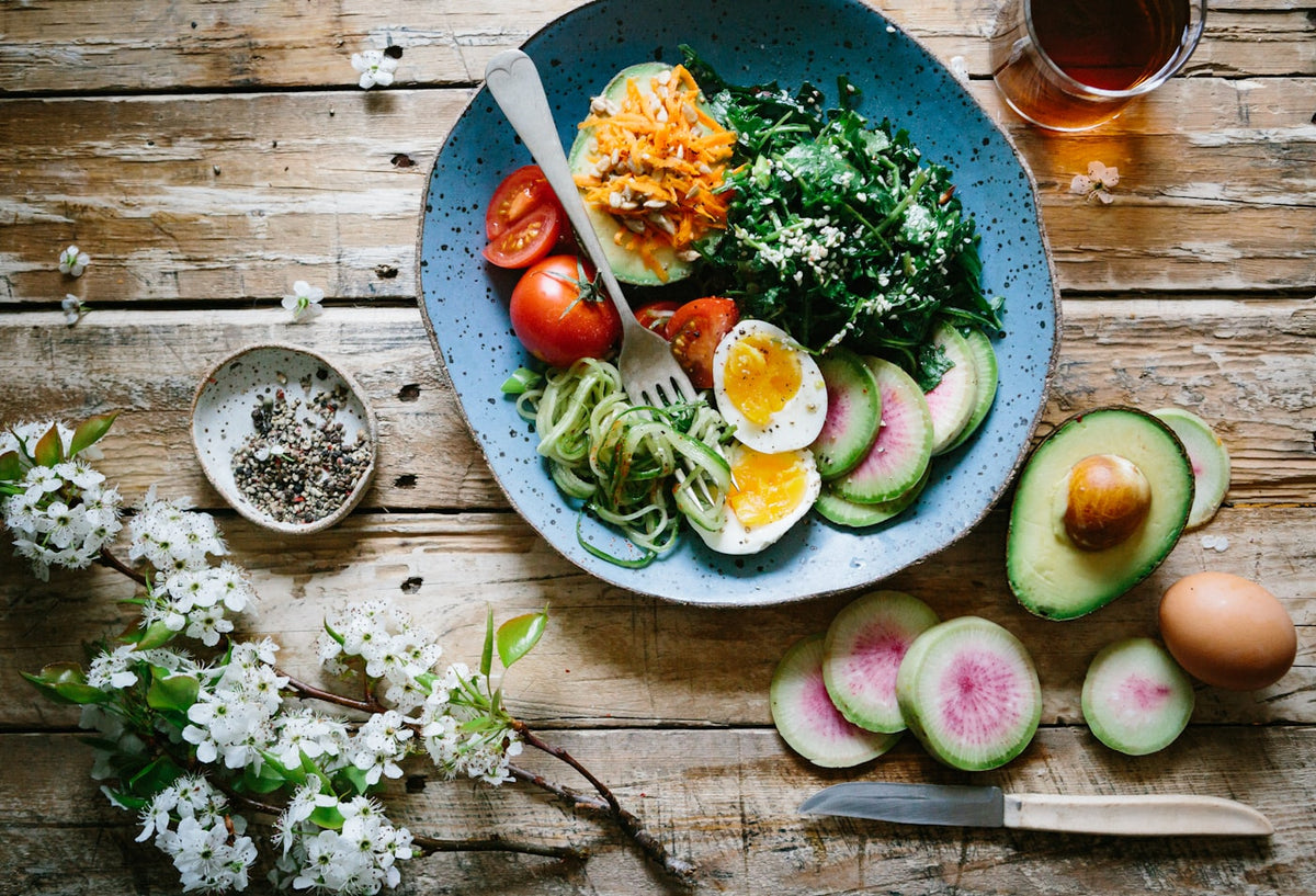 Colorful vegetable and egg bowl representing gut health nutrition alongside peptide therapy