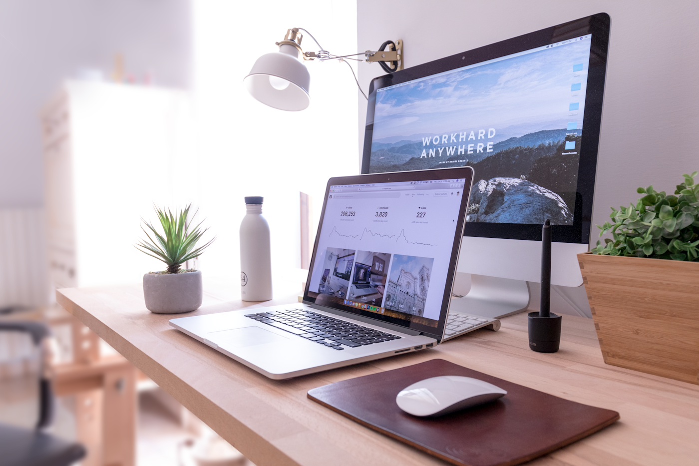 Clean modern desk workspace with laptop and monitor, focus theme