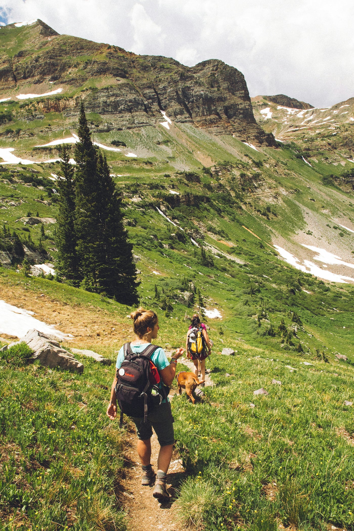 Two women hiking on a mountain trail