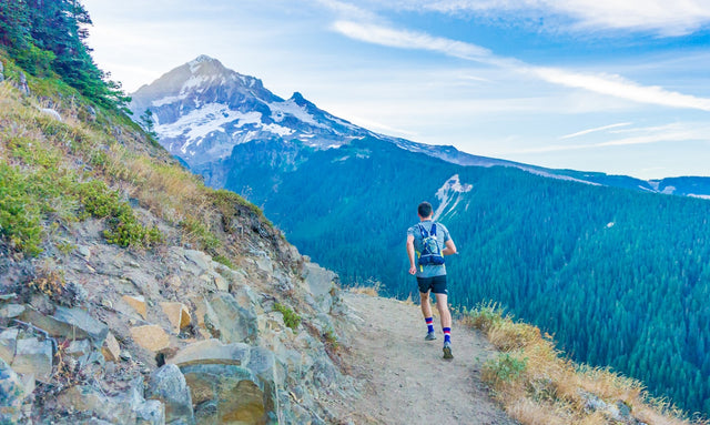 Trail runner on mountain path maintaining fitness while on GLP-1 therapy