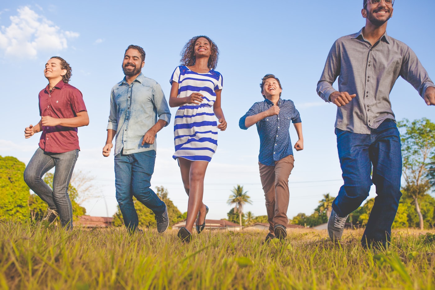 A diverse group of friends walking outdoors together in natural light, an active healthy lifestyle scene