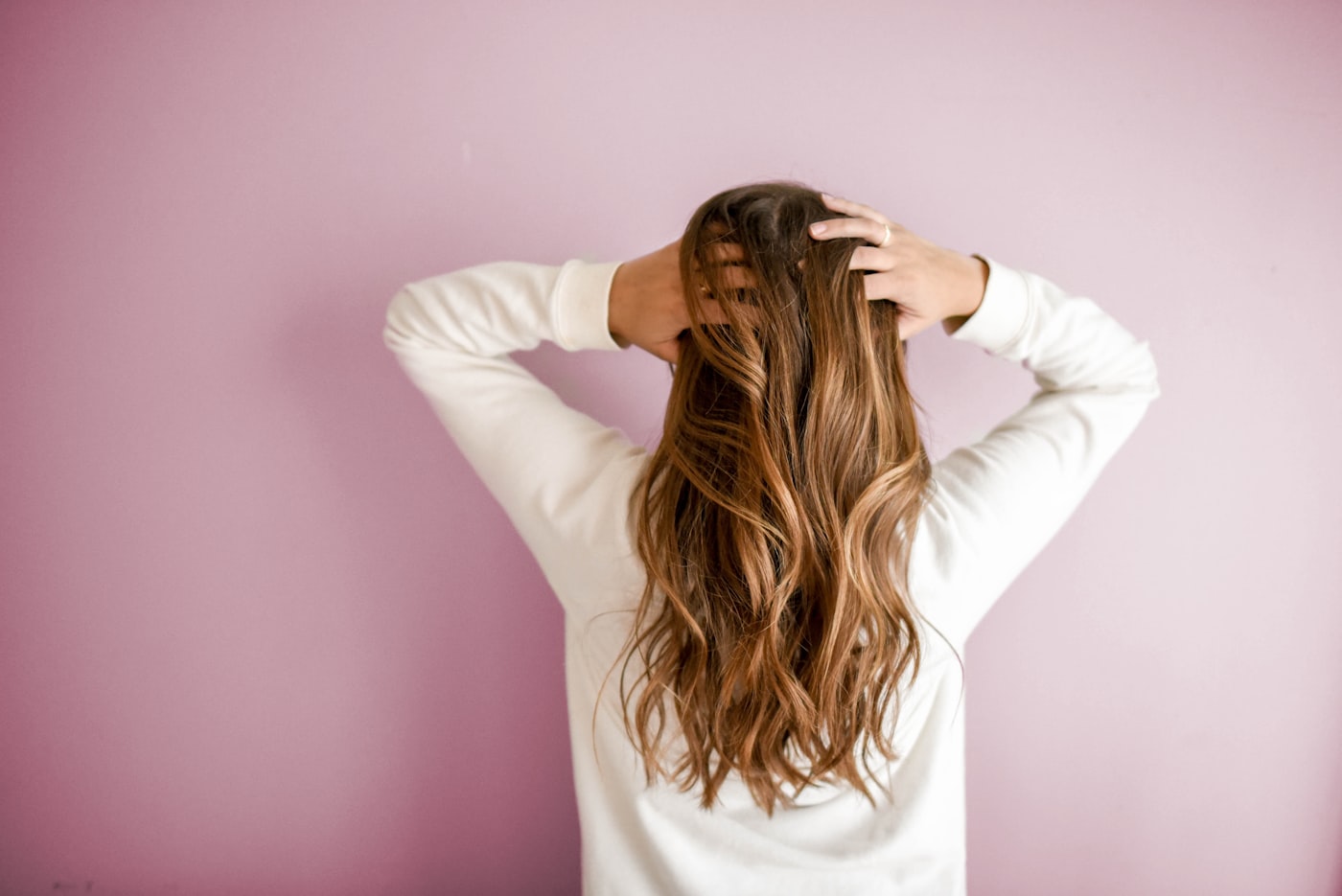 Woman with healthy, thick hair representing research on peptides for hair growth