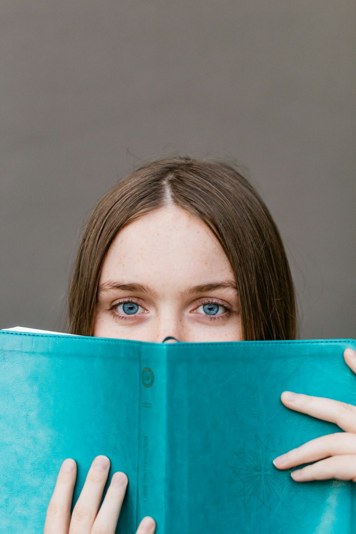 Woman reading, comparing telehealth options