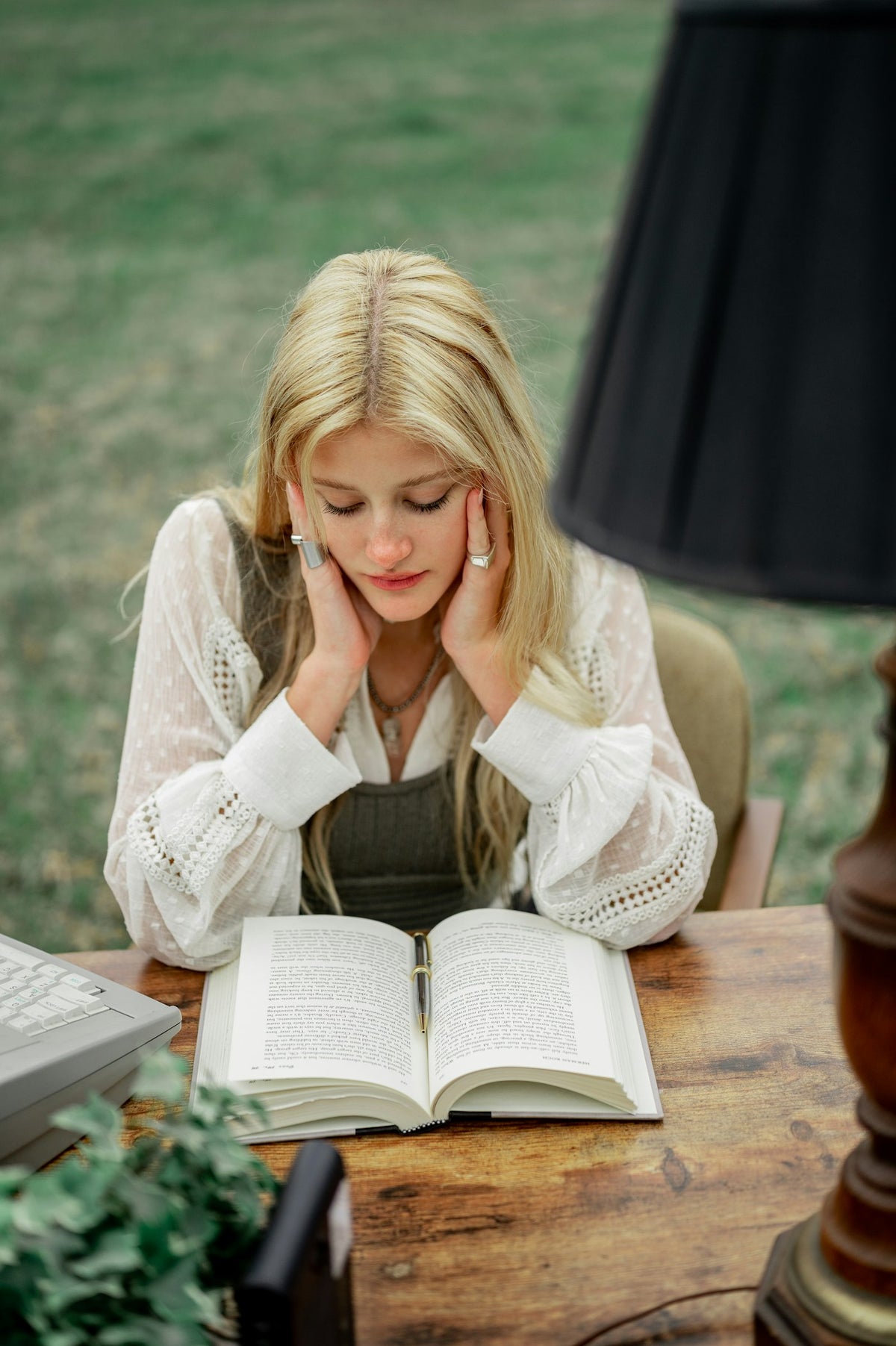 Woman reading a book, researching telehealth options
