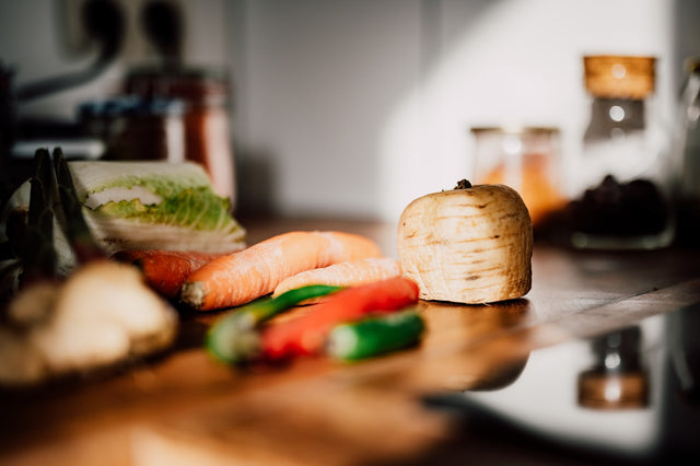 Sliced vegetables on a wooden chopping board