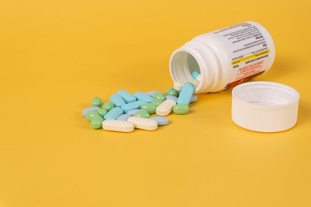 A container of pills, representing oral medication