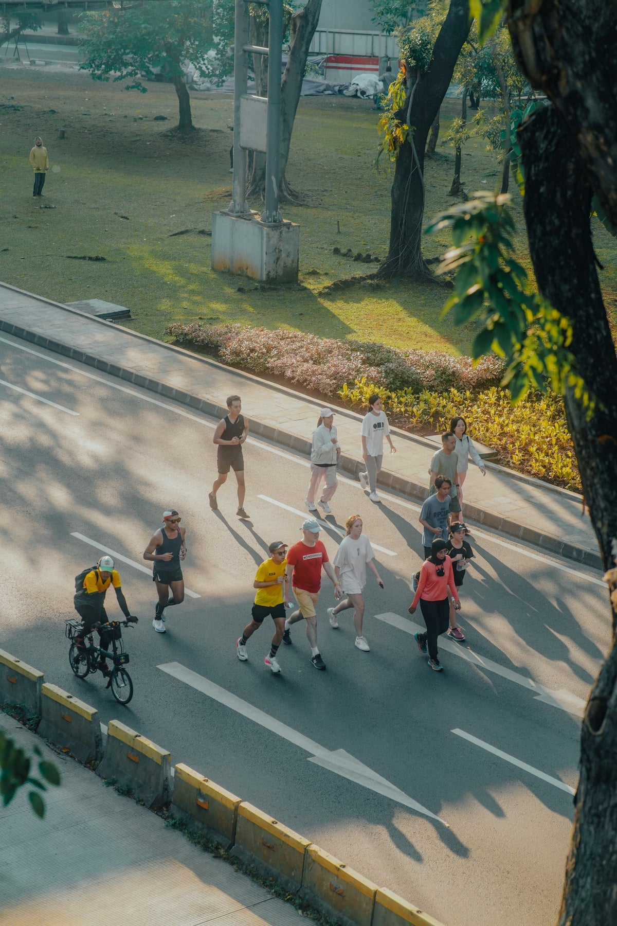 a group of people running on a road