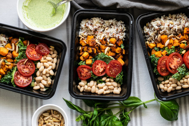 a group of trays with food