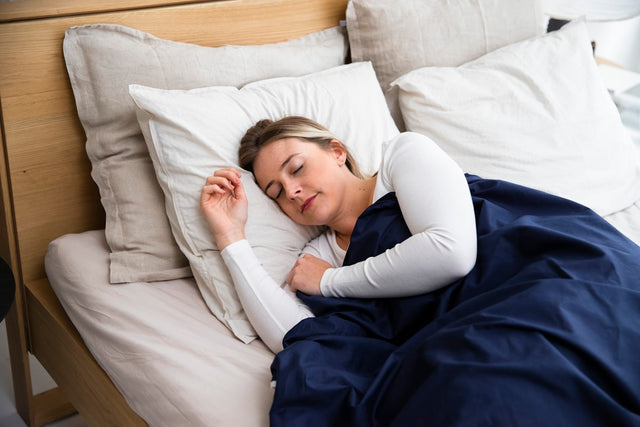 Person sleeping peacefully in a cozy bedroom environment