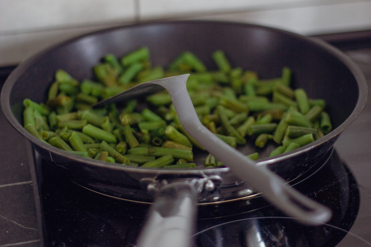 Green beans cooking in a pan, representing GLP-1 friendly foods