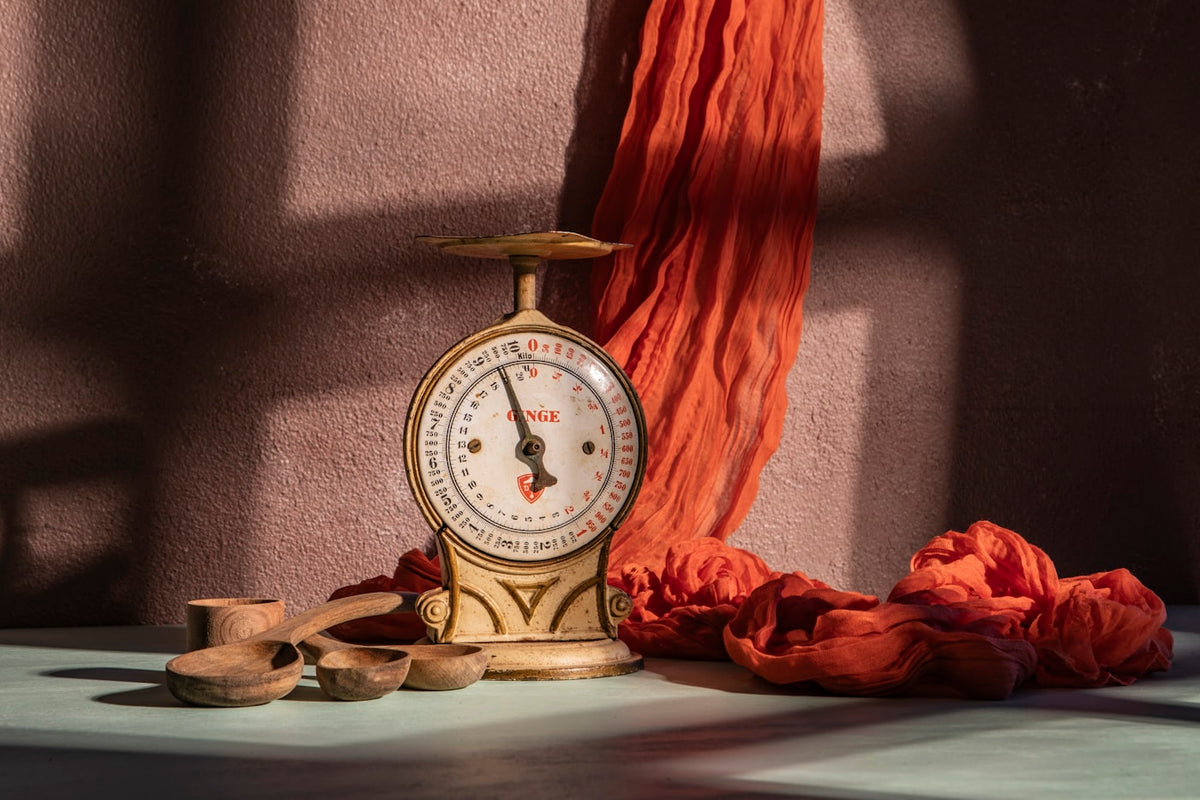 A bathroom scale in a softly lit setting, representing weight tracking