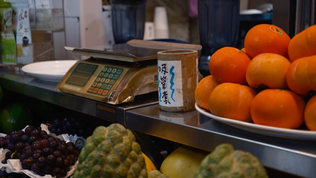 Fresh fruits and vegetables displayed at a market.