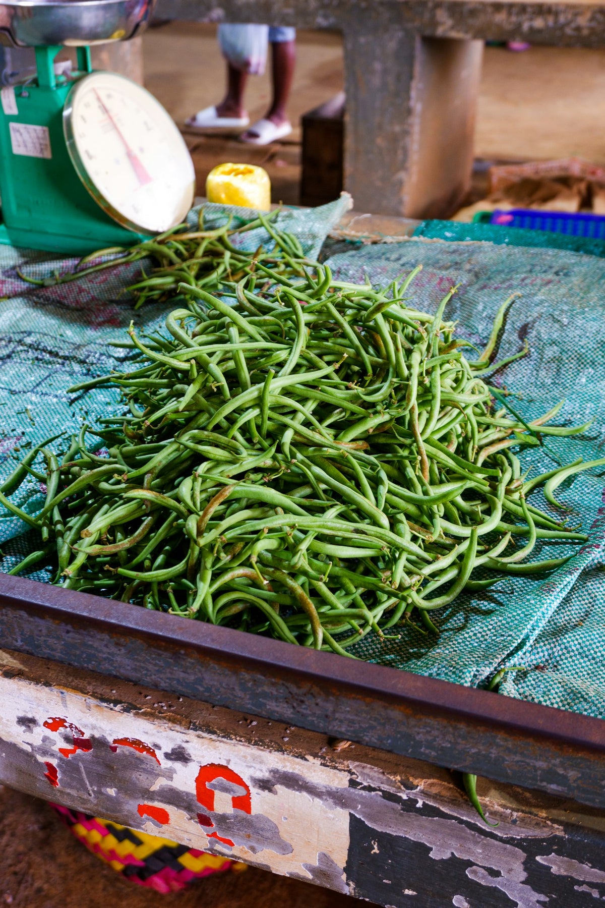 Pile of fresh green beans on a market stall