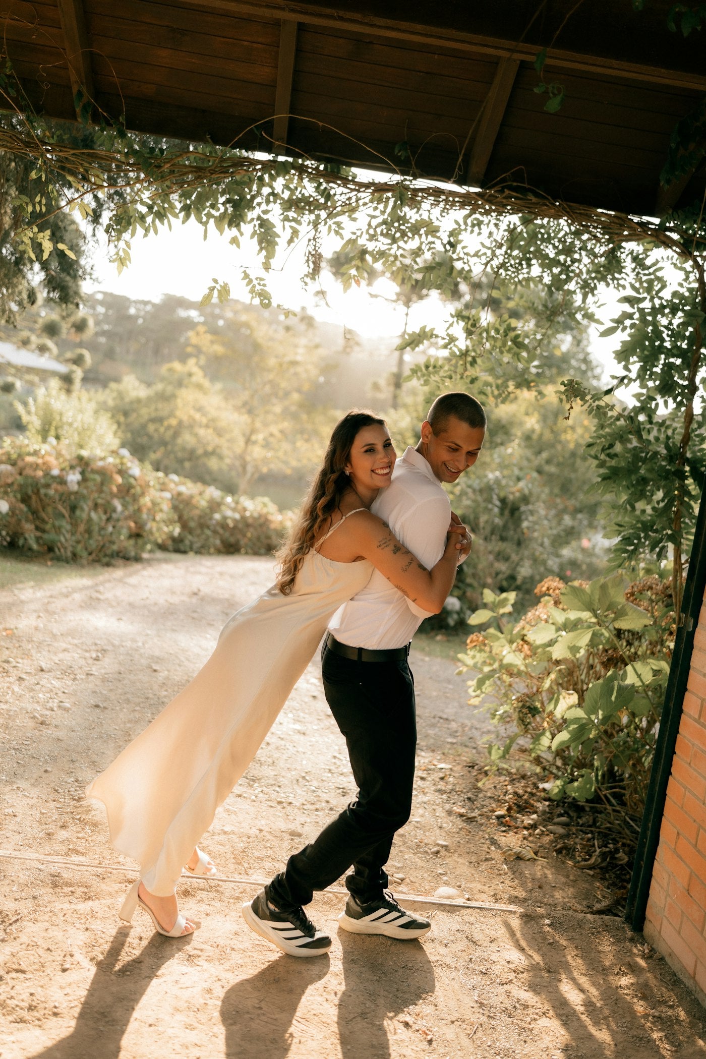 Couple embracing outdoors in warm light — representing connection and sexual health research at TelosRX