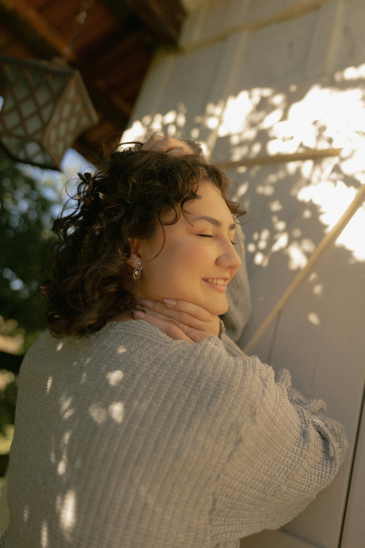 Woman smiling in warm sunlight