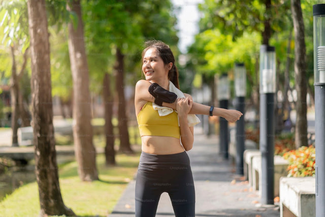 Woman stretching before a morning run outdoors — active healthy lifestyle